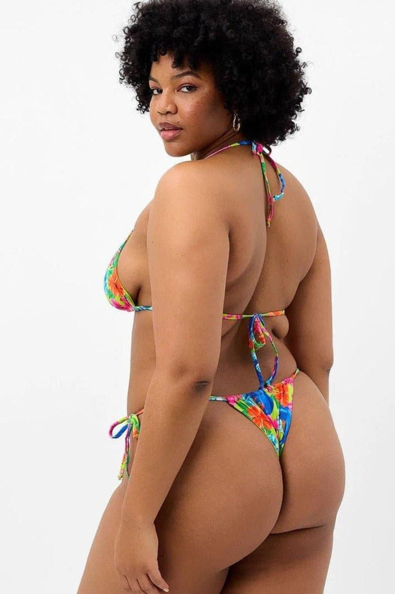 Shop Frankies Bikinis Frankies Bikinis Tia Floral String Bikini Bottom in Neon Surfer Bikini Bottoms for women – premium loungewear and festival fashion at Spoiled Brat
