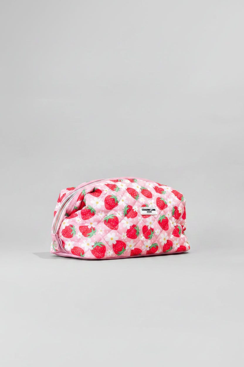Small pouch with strawberry pattern on a beige background