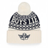 A cream and navy blue knit pom-pom beanie with 'BOYS LITE' written across the upper section and a small cherub graphic on the folded cuff.