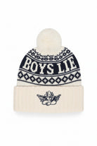A cream and navy blue knit pom-pom beanie with 'BOYS LITE' written across the upper section and a small cherub graphic on the folded cuff.