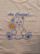Samii Ryan x Smileyworld® Good Days Baby Tee T-Shirt by Samii Ryan as seen on celebrities