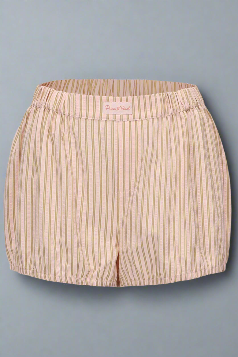 Beige striped shorts on a light gray background