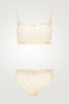 Yellow bikini set with a textured pattern on a white background