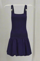 Navy blue dress with straps on a white background