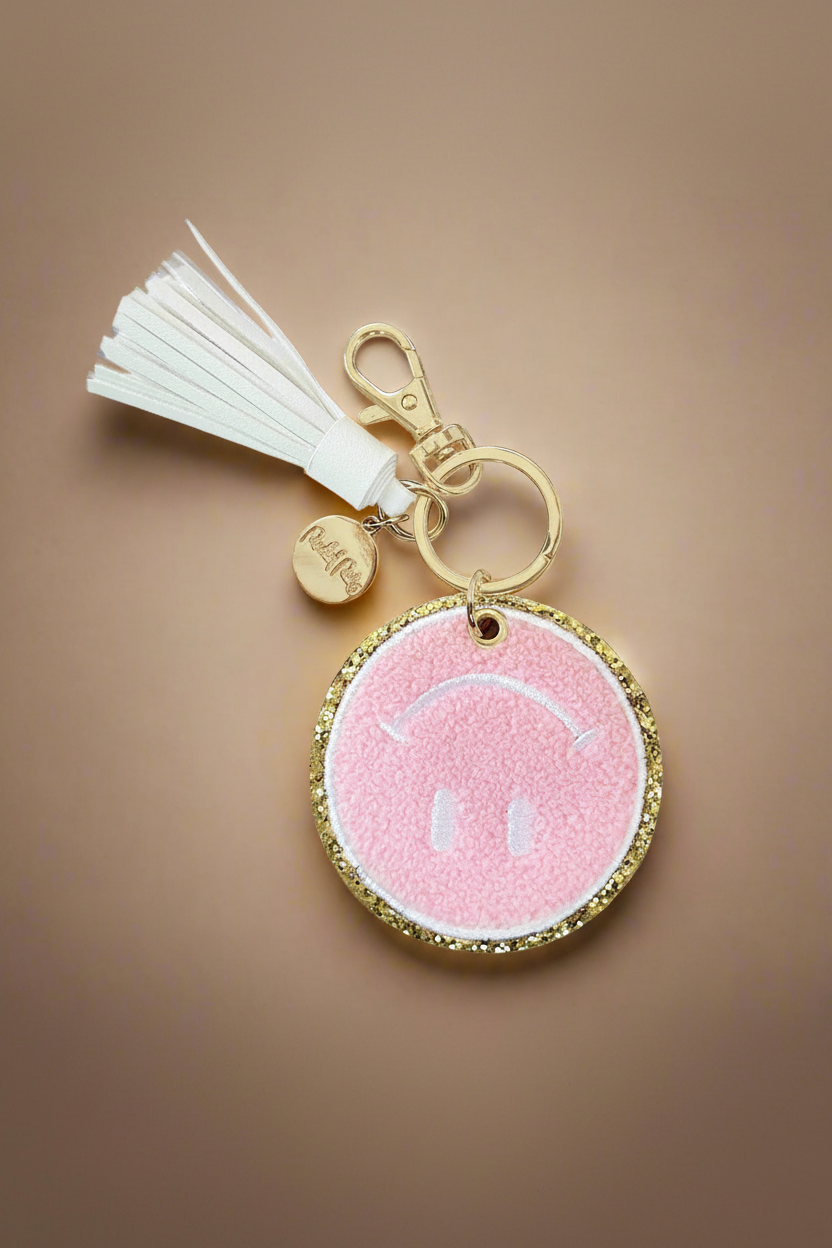 Packed Party Keep Cozy Smiley Keychain by Packed Party – Keyring – Pink | Spoiled Brat UK