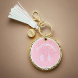 Packed Party Keep Cozy Smiley Keychain by Packed Party – Keyring – Pink | Spoiled Brat UK