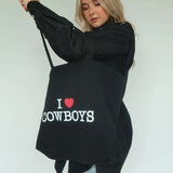 Shop Brunette The Label Brunette The Label "I Love Cowboys" Tote Bag Tote Bag for women – premium loungewear and festival fashion at Spoiled Brat