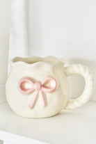 Shop Coconut Lane Coconut Lane Pink Bow Mug Mug for women – premium loungewear and festival fashion at Spoiled Brat