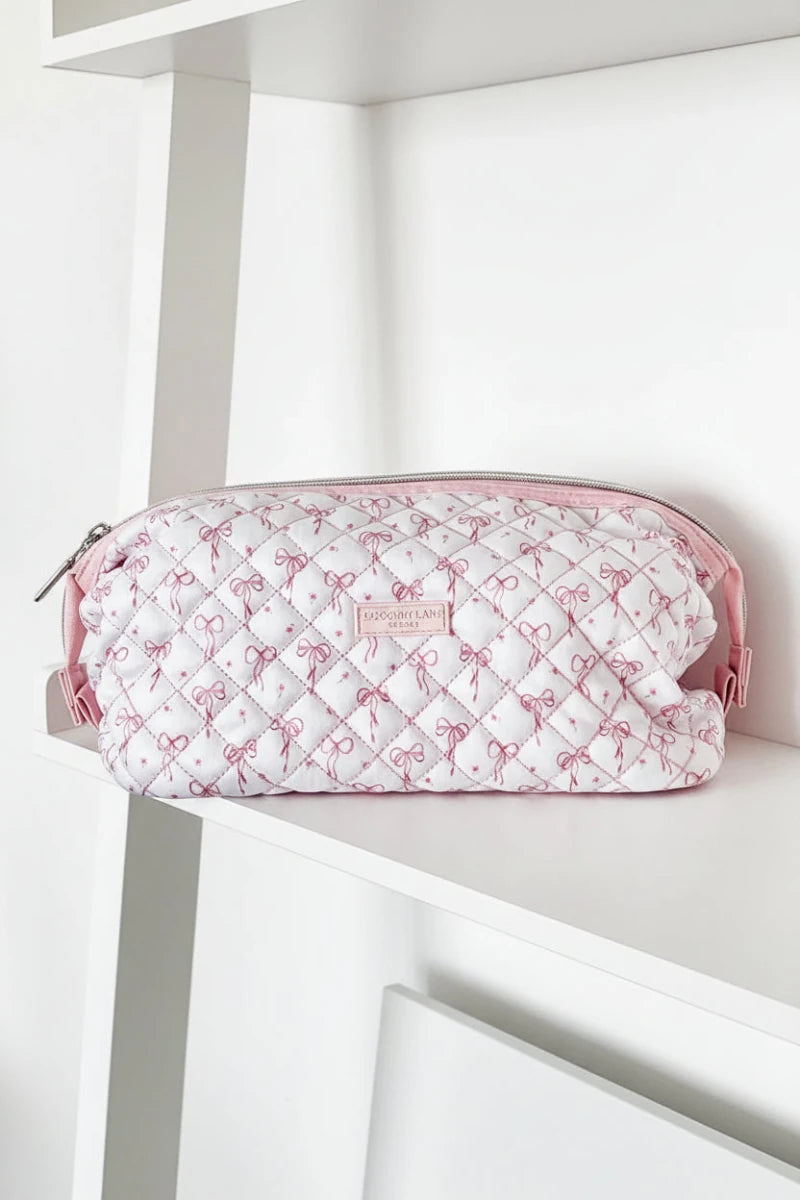 Shop Coconut Lane Coconut Lane Quilted Dainty Bows Expandable Cosmetic Bag Cosmetic Case for women – premium loungewear and festival fashion at Spoiled Brat