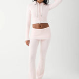 Shop Frankies Bikinis Frankies Bikinis Aimee Cloud Knit Flare Pant in Rosebud Pink Trousers for women – premium loungewear and festival fashion at Spoiled Brat