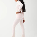 Shop Frankies Bikinis Frankies Bikinis Aimee Cloud Knit Flare Pant in Rosebud Pink Trousers for women – premium loungewear and festival fashion at Spoiled Brat