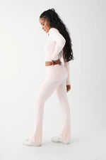 Shop Frankies Bikinis Frankies Bikinis Aimee Cloud Knit Flare Pant in Rosebud Pink Trousers for women – premium loungewear and festival fashion at Spoiled Brat