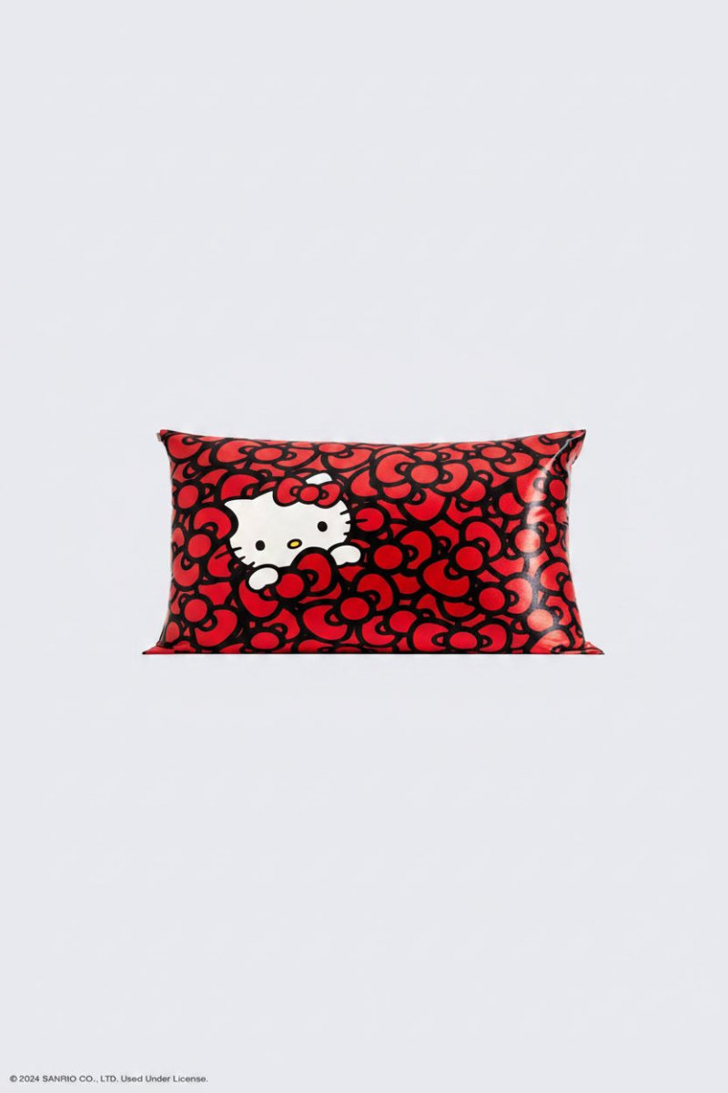 Shop Kitsch Hello Kitty x Kitsch Satin Pillowcase - Hello Kitty Bathes in a Sea of Bows Pillow for women – premium loungewear and festival fashion at Spoiled Brat