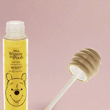 Shop Mad Beauty Mad Beauty Winnie The Pooh Lip Oil Lip Gloss for women – premium loungewear and festival fashion at Spoiled Brat