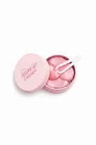 Pink makeup eraser with a white background
