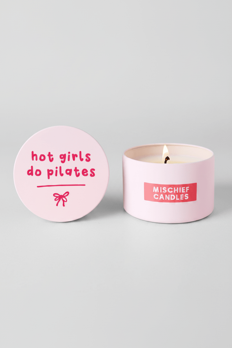 Shop Mischief Candles Hot Girls Do Pilates Pink Tin Candle Candles for women – premium loungewear and festival fashion at Spoiled Brat