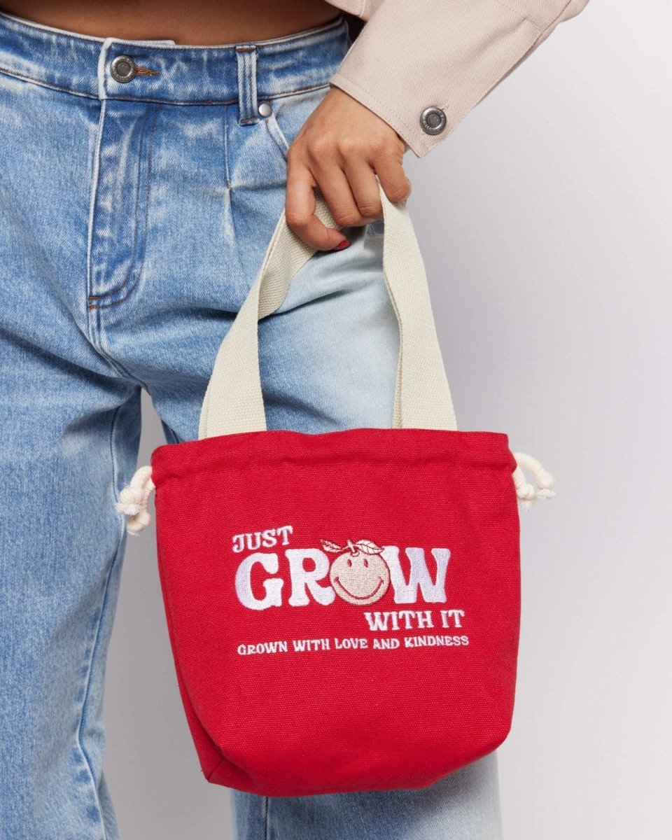Shop Samii Ryan Samii Ryan x Smiley® Just Grow With It Bucket Bag Clutch Bag for women – premium loungewear and festival fashion at Spoiled Brat