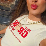 Shop Samii Ryan Samii Ryan x Smileyworld® Just Grow With It Baby Tee T-Shirt for women – premium loungewear and festival fashion at Spoiled Brat