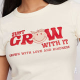 Shop Samii Ryan Samii Ryan x Smileyworld® Just Grow With It Baby Tee T-Shirt for women – premium loungewear and festival fashion at Spoiled Brat