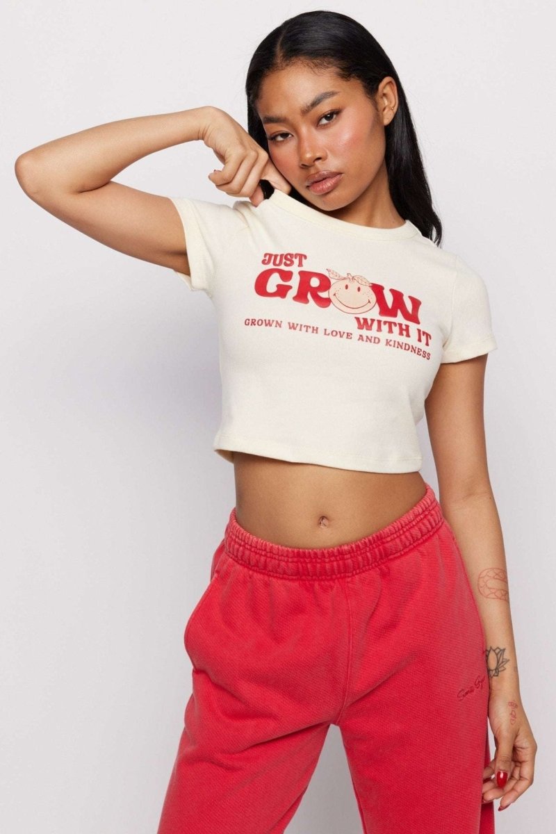Shop Samii Ryan Samii Ryan x Smileyworld® Just Grow With It Baby Tee T-Shirt for women – premium loungewear and festival fashion at Spoiled Brat