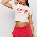 Shop Samii Ryan Samii Ryan x Smileyworld® Just Grow With It Baby Tee T-Shirt for women – premium loungewear and festival fashion at Spoiled Brat