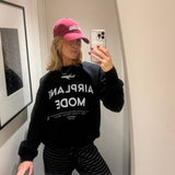 Shop The Laundry Room The Laundry Room Airplane Mode Sweater as seen on Chloe Meadows Jumper for women – premium loungewear and festival fashion at Spoiled Brat