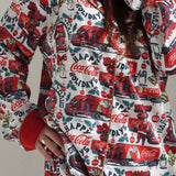 Shop The Laundry Room The Laundry Room Happy Coca - Cola Holidays Silky PJ Set Pyjamas for women – premium loungewear and festival fashion at Spoiled Brat