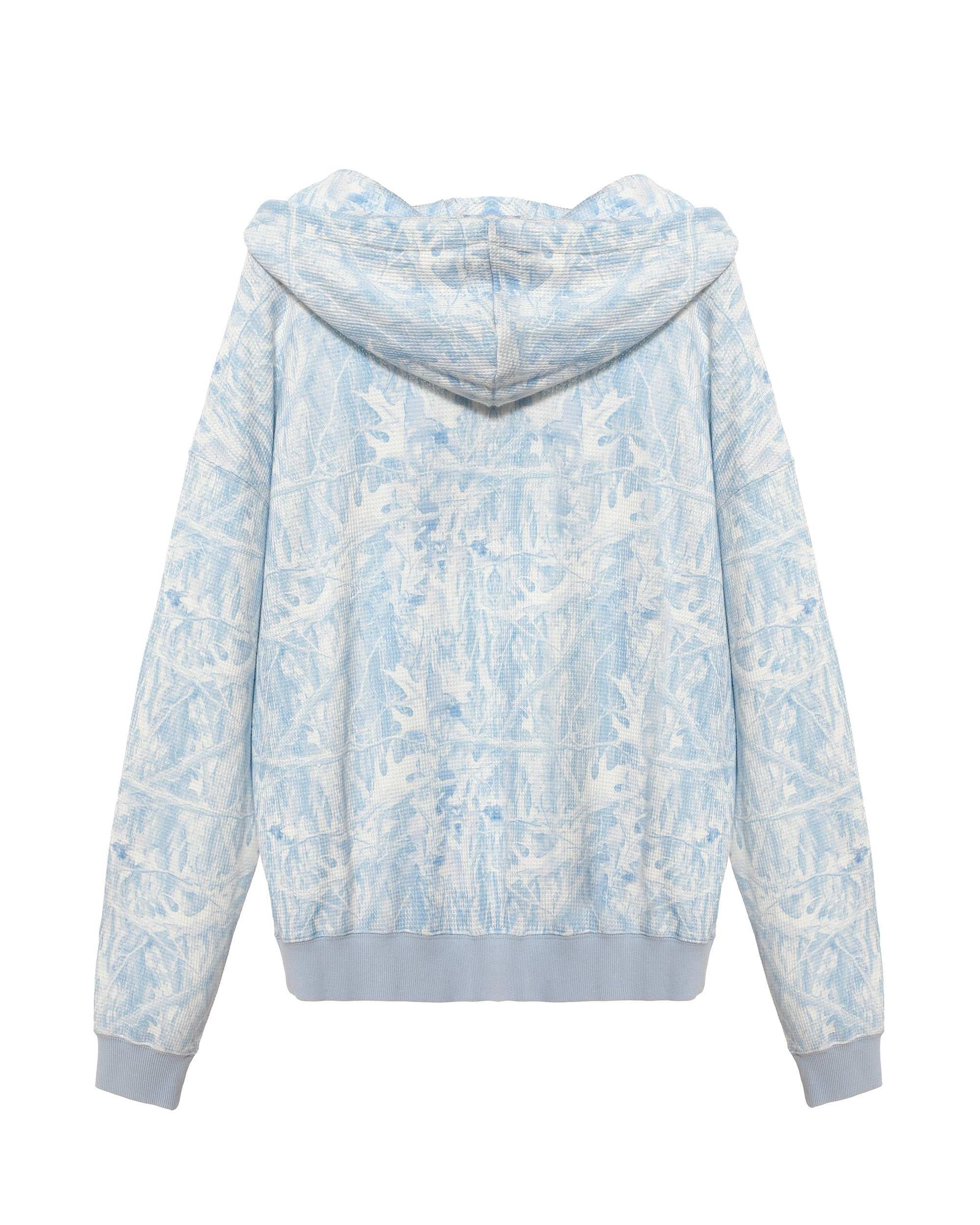 Light blue and white floral patterned hoodie on a white background
