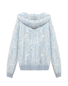 Light blue and white floral patterned hoodie on a white background