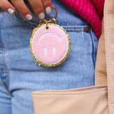 Packed Party Keep Cozy Smiley Keychain by Packed Party – Keyring – Pink | Spoiled Brat UK
