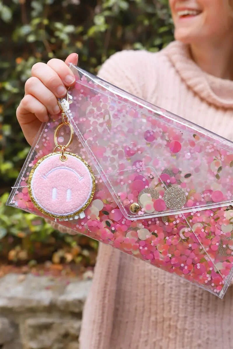 Packed Party Keep Cozy Smiley Keychain by Packed Party – Keyring – Pink | Spoiled Brat UK