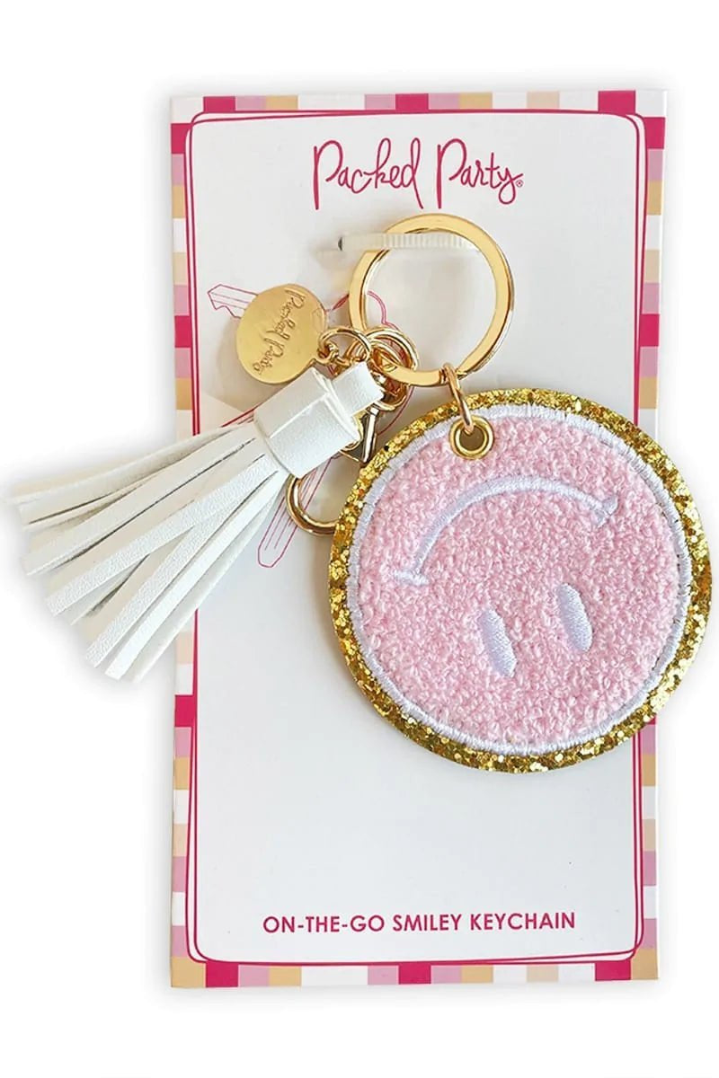 Packed Party Keep Cozy Smiley Keychain by Packed Party – Keyring – Pink | Spoiled Brat UK